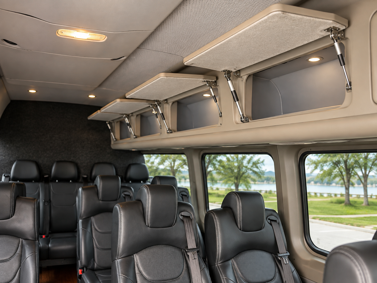 Overhead storage compartments and leather passenger seating inside the Four Season Travel Mercedes-Benz Sprinter