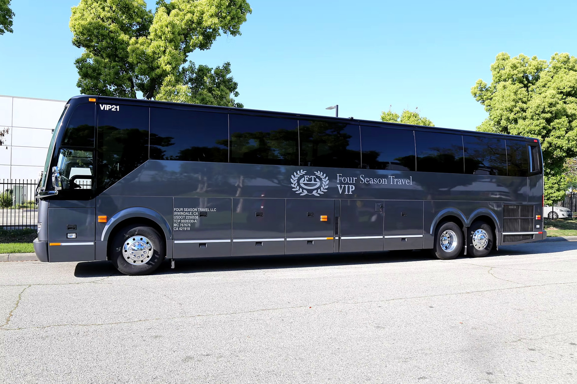Four Season Travel VIP coach full side profile showing the laurel wreath livery