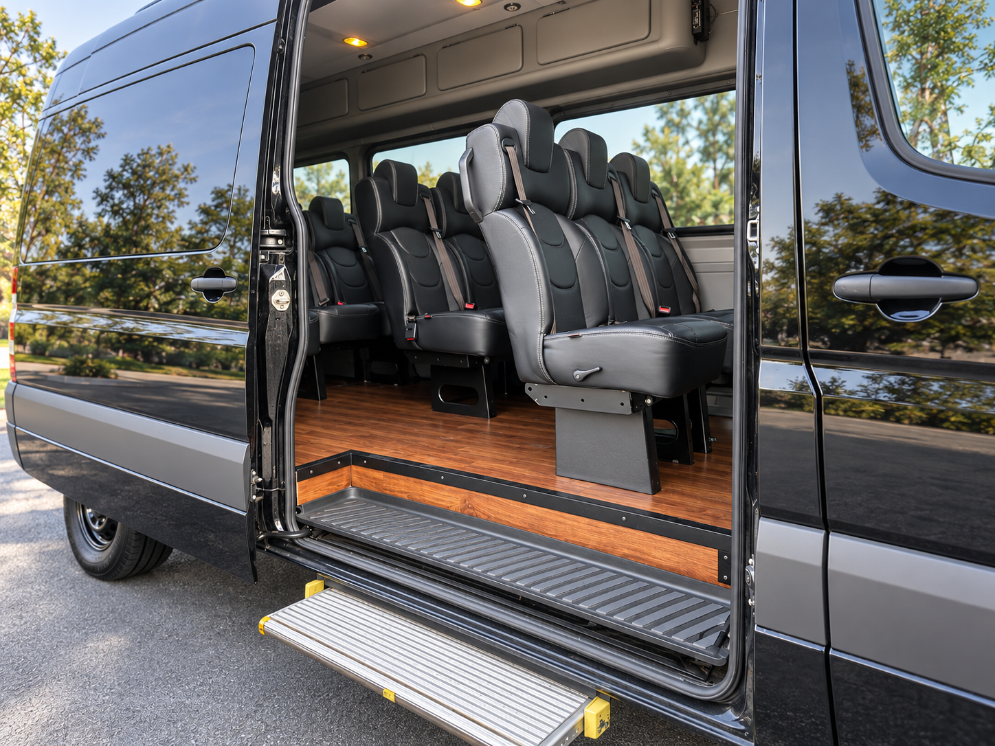 Open side door of the Four Season Travel Mercedes-Benz Sprinter showing the entry step, wood floor, and premium seating