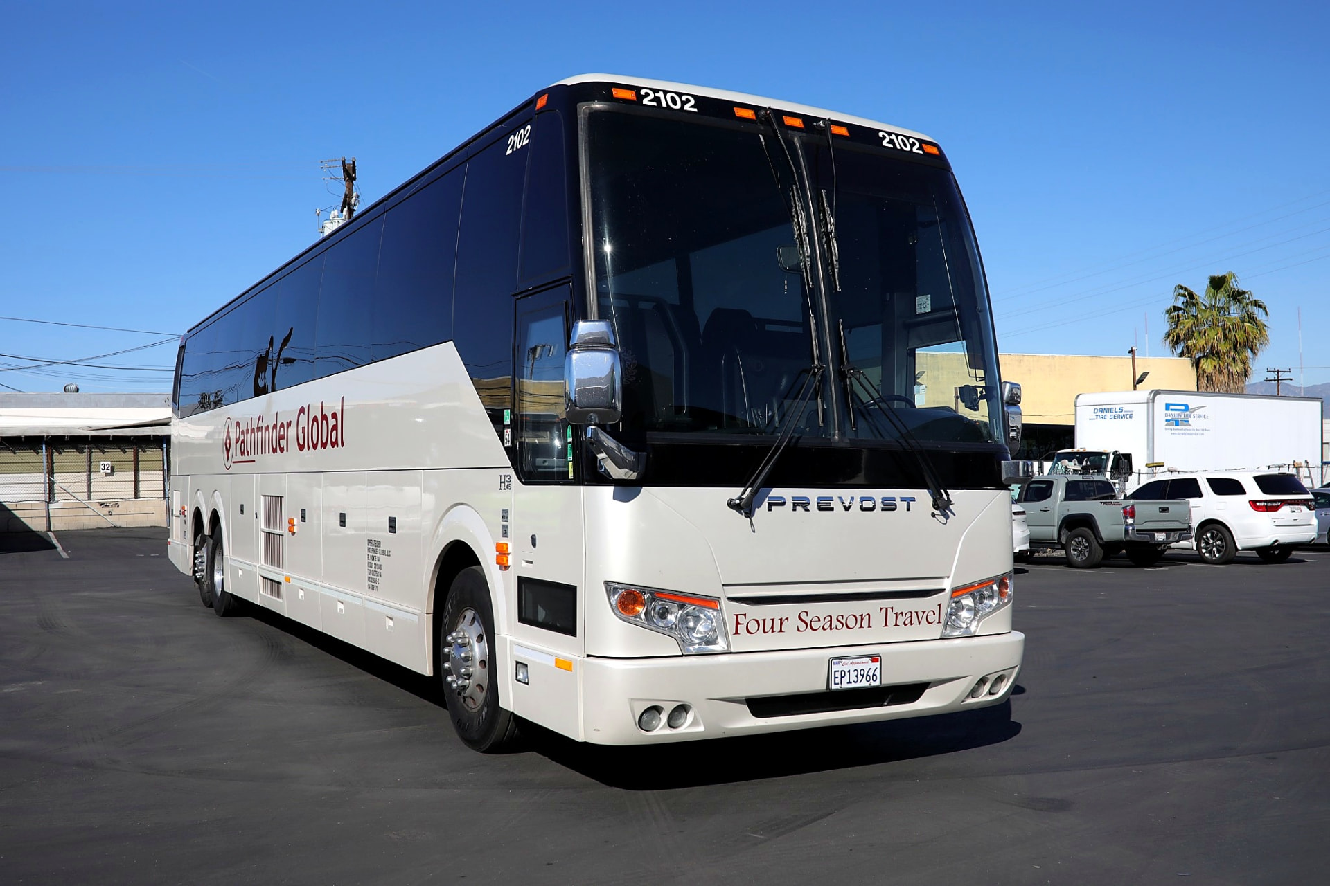 Four Season Travel full size charter coach parked in full side profile