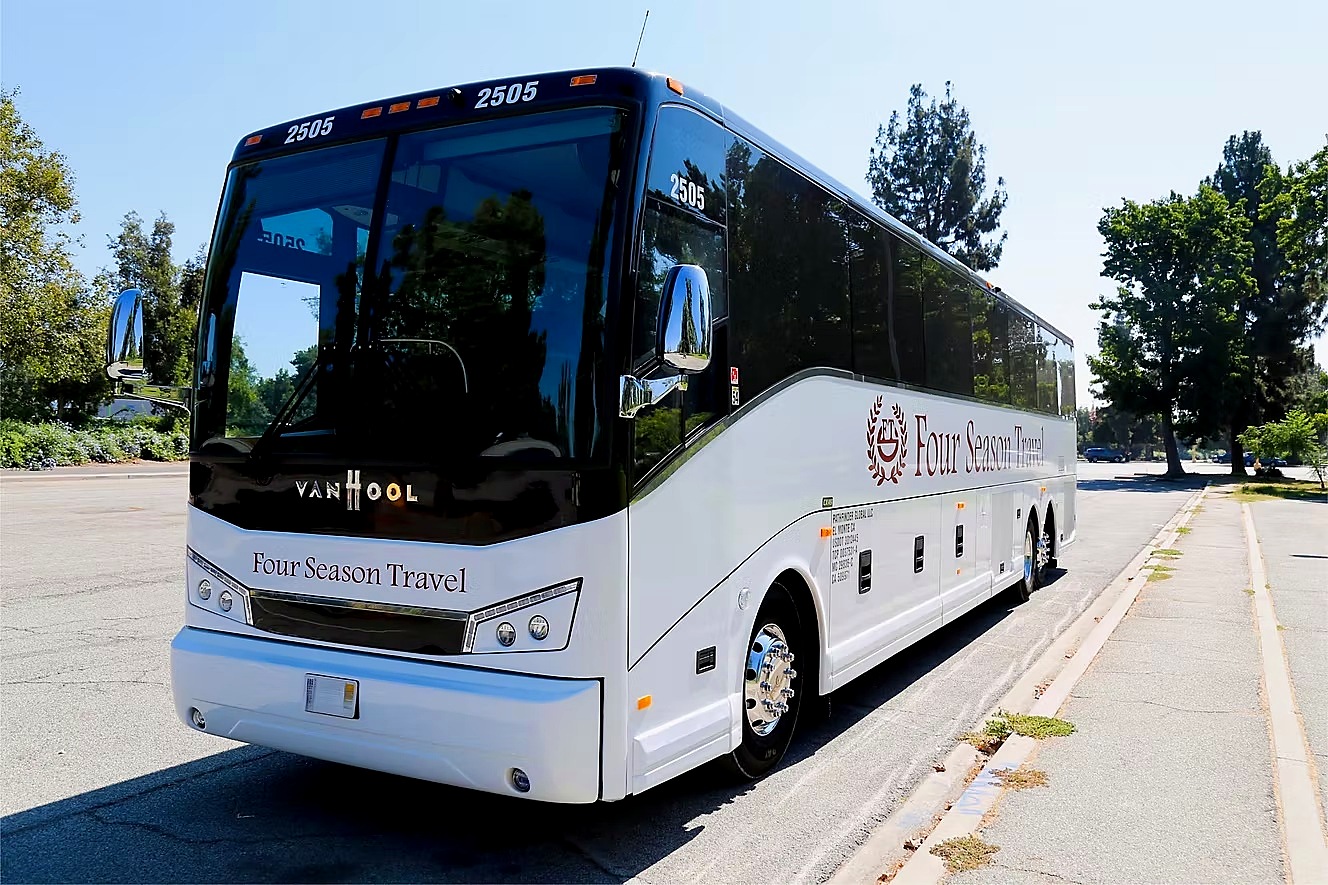 Four Season Travel full-size Van Hool motorcoach, front three-quarter exterior view