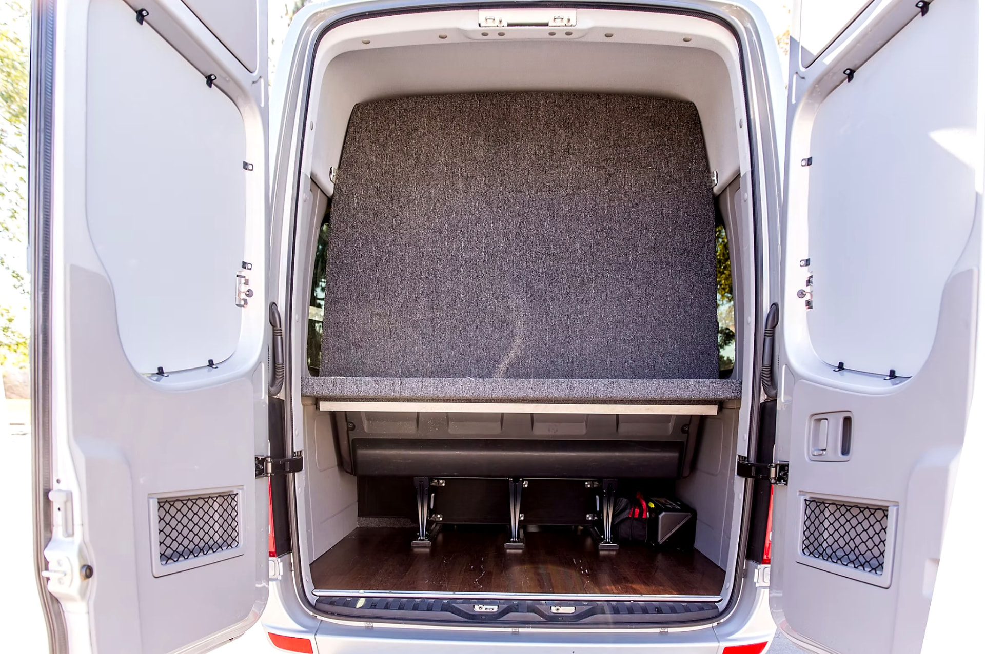 Rear luggage compartment of the Four Season Travel Mercedes-Benz Sprinter with the back doors open